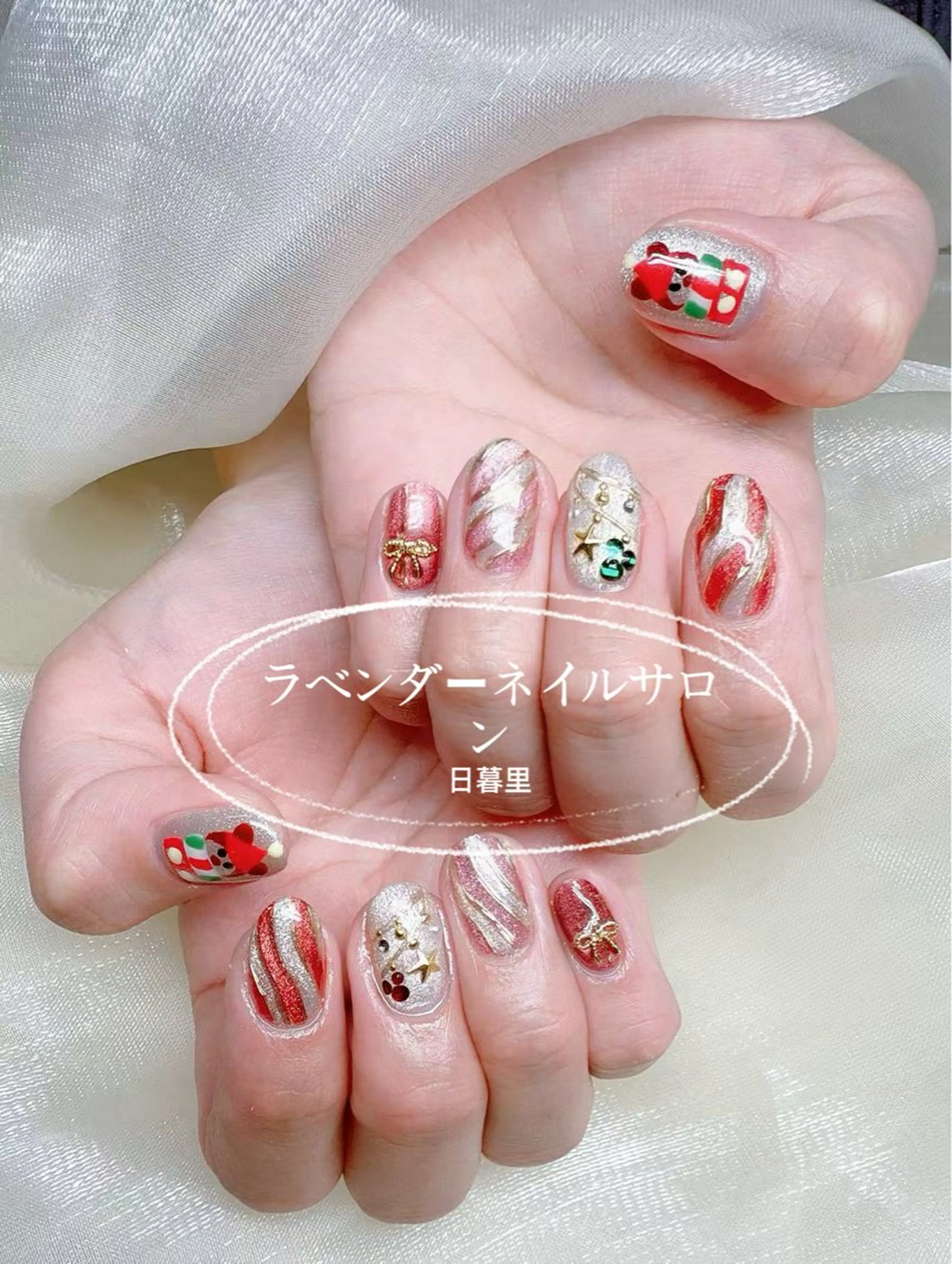 ネイル アートネイル ゴールド 赤色 リボン 冬ネイル lavender所属・日暮里🦋 lavenderのエステ・リラクイメージ