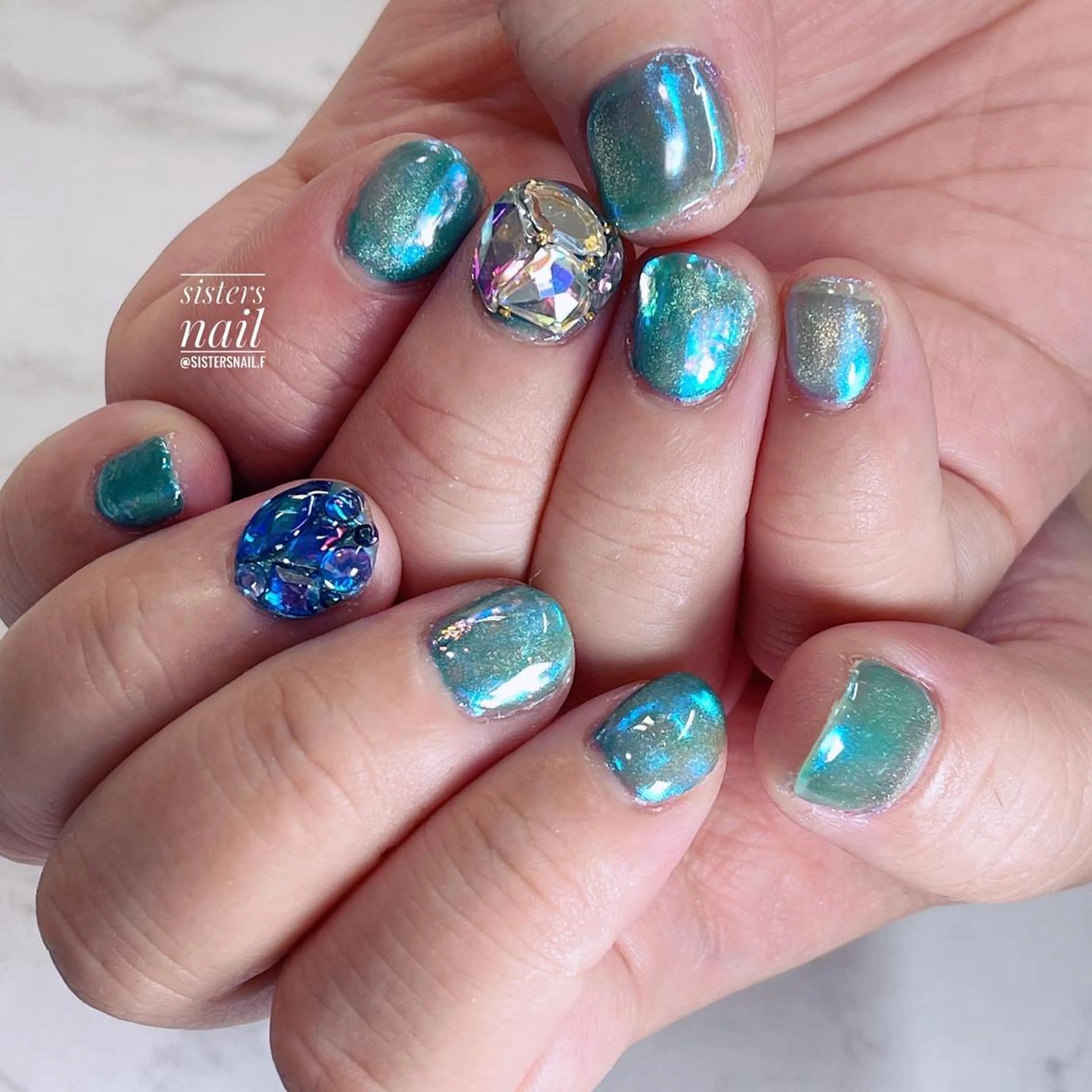 ネイル アートネイル オーロラネイル ブルー 氷ネイル・うるうるネイル キラキラネイル sisters nail.fのネイルデザイン