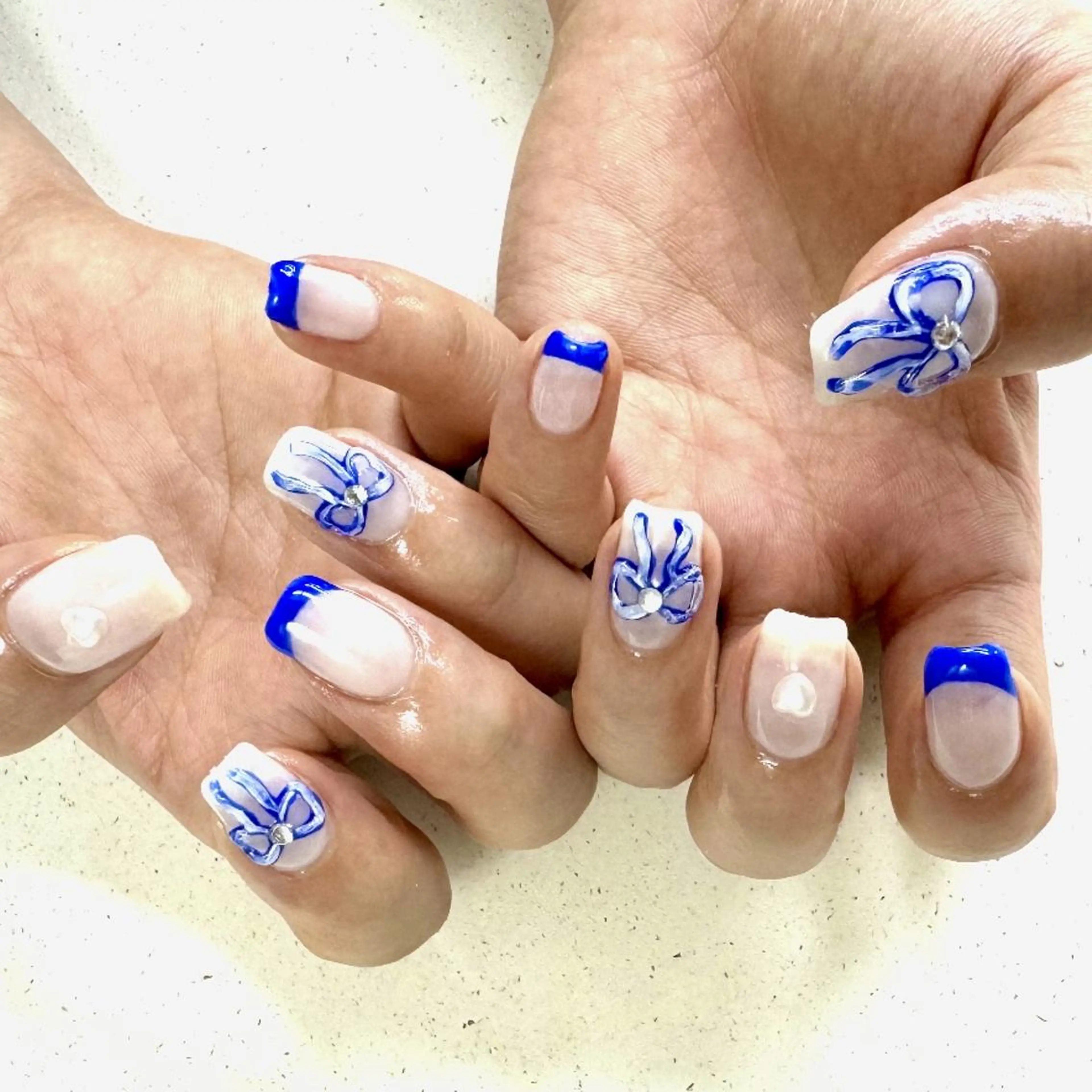 ネイル ジェルネイル 韓国ネイル ニュアンスネイル リボン ワンホンネイル nailstudio eviz新宿店のネイルデザイン