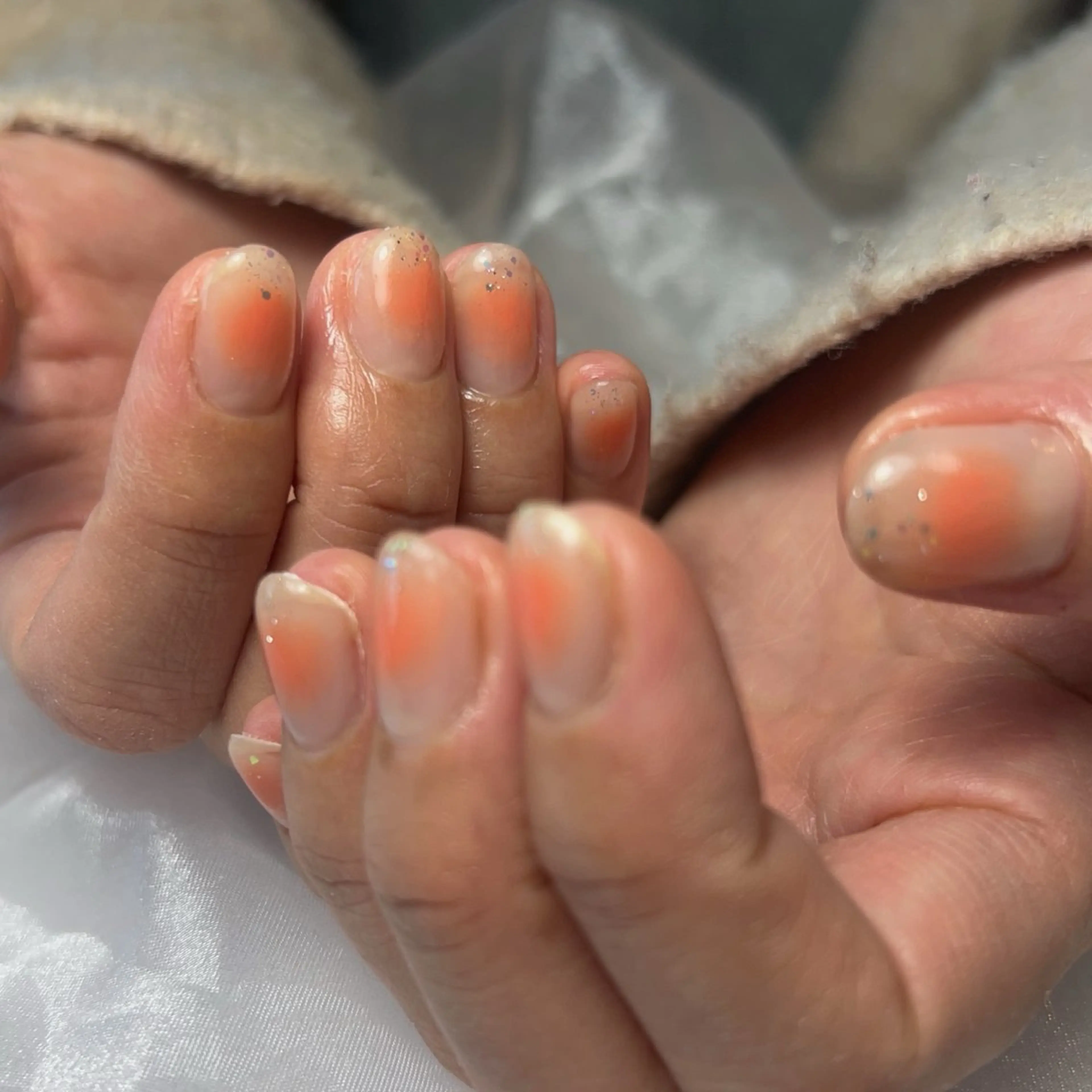 ネイル チークネイル 氷ネイル・うるうるネイル キラキラネイル オフィスネイル オレンジ ハンドネイル LooP - RECO-のネイルデザイン