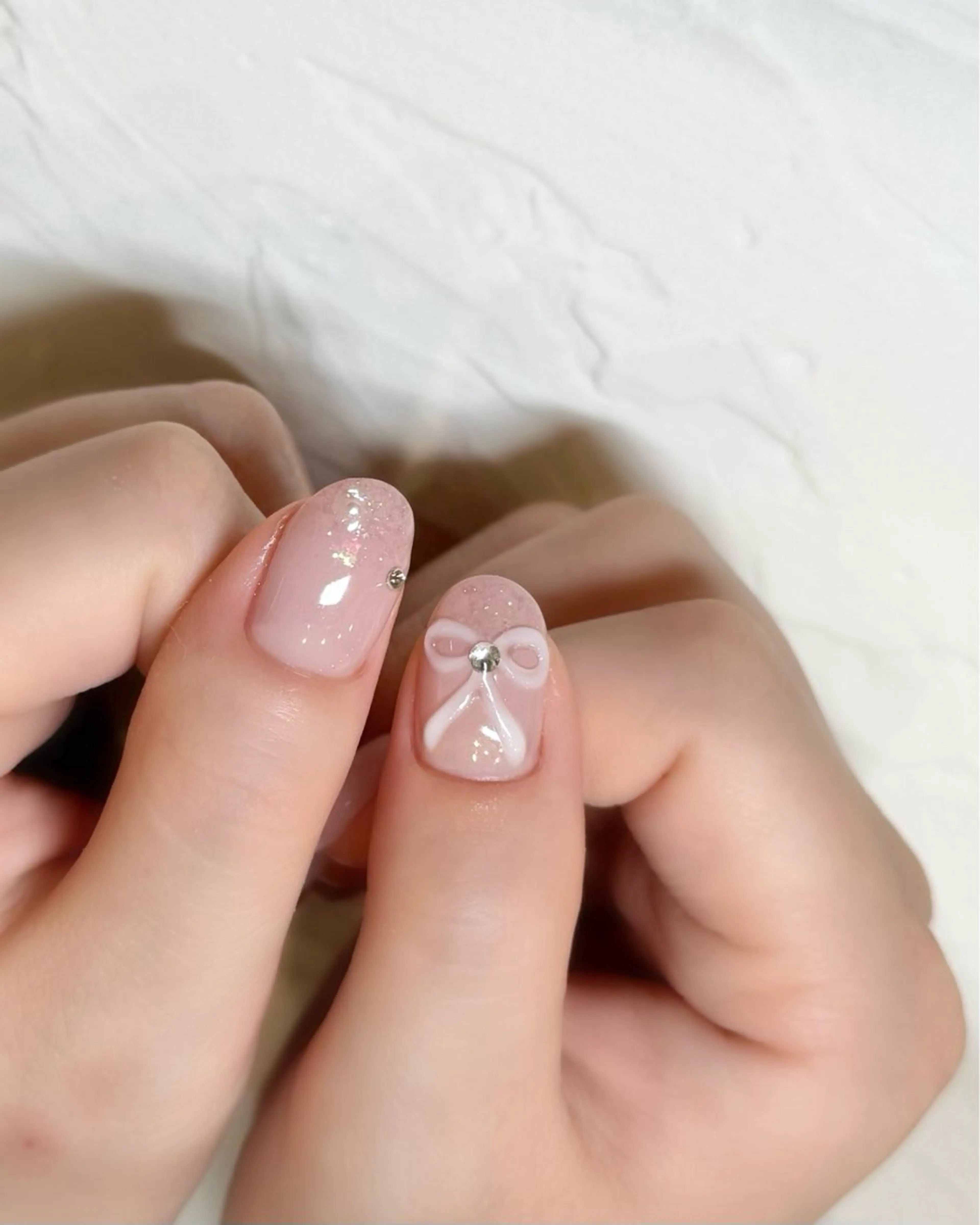 ネイル オーロラネイル フラッシュネイル ガーリー キラキラネイル リボン nail salon neige所属・ジェムネイル Risa.のネイルデザイン