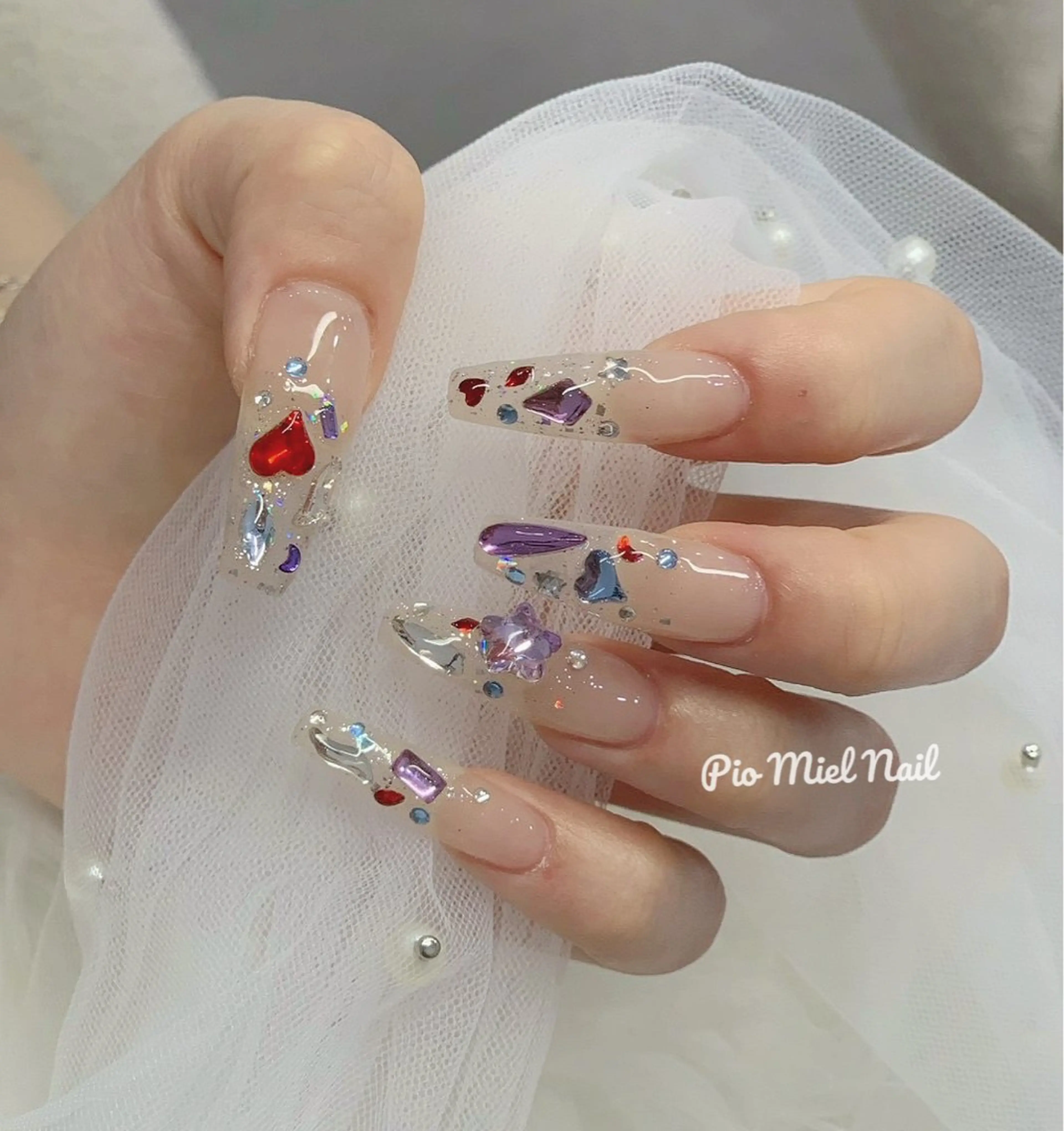 ロング ハンドネイル Pio Mielのネイルデザイン