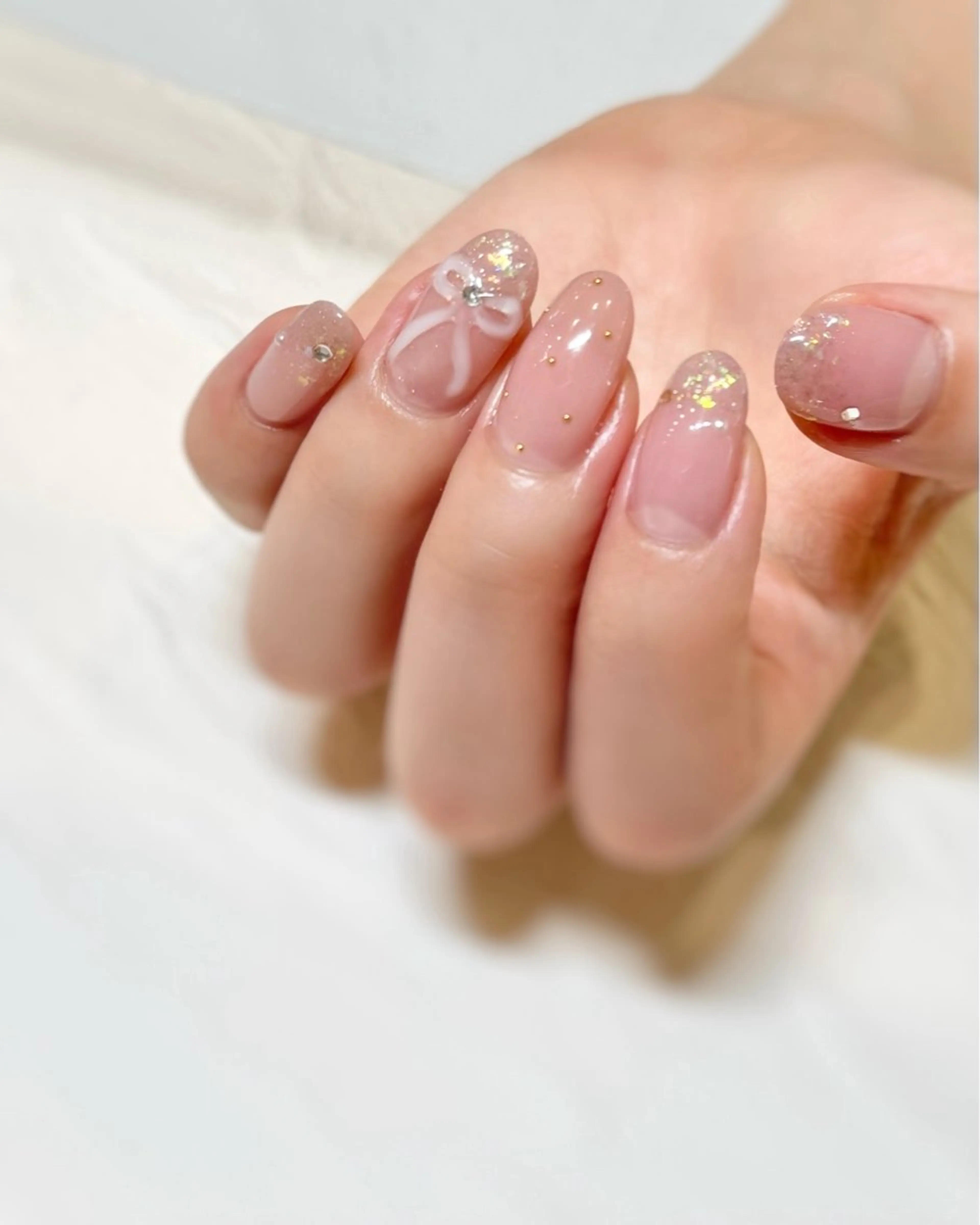 ネイル ガーリー キラキラネイル ピンク リボン nail salon neige所属・ジェムネイル Risa.のネイルデザイン