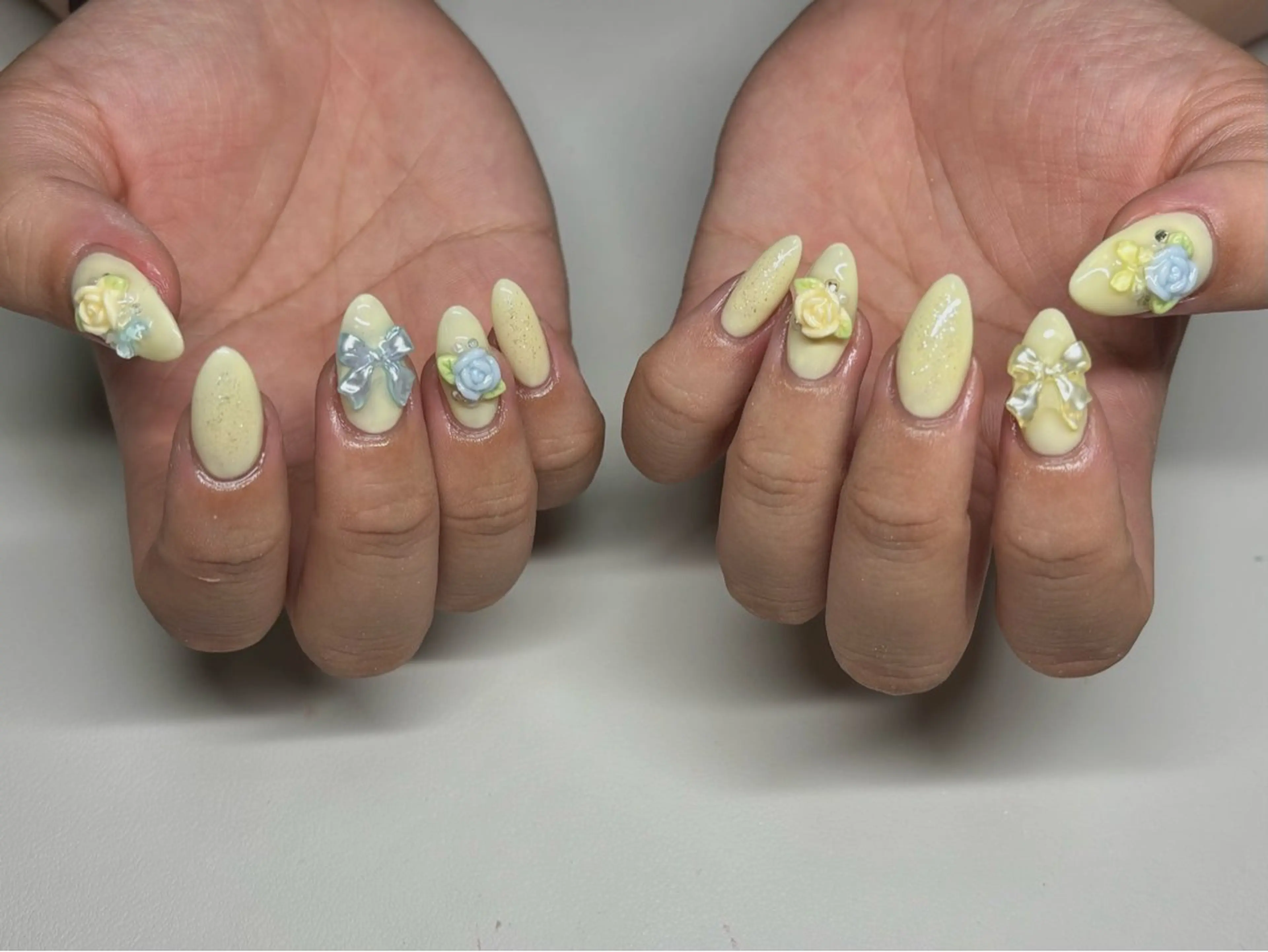 ネイル リボン 黄色 ハンドネイル nayu nailのネイルデザイン