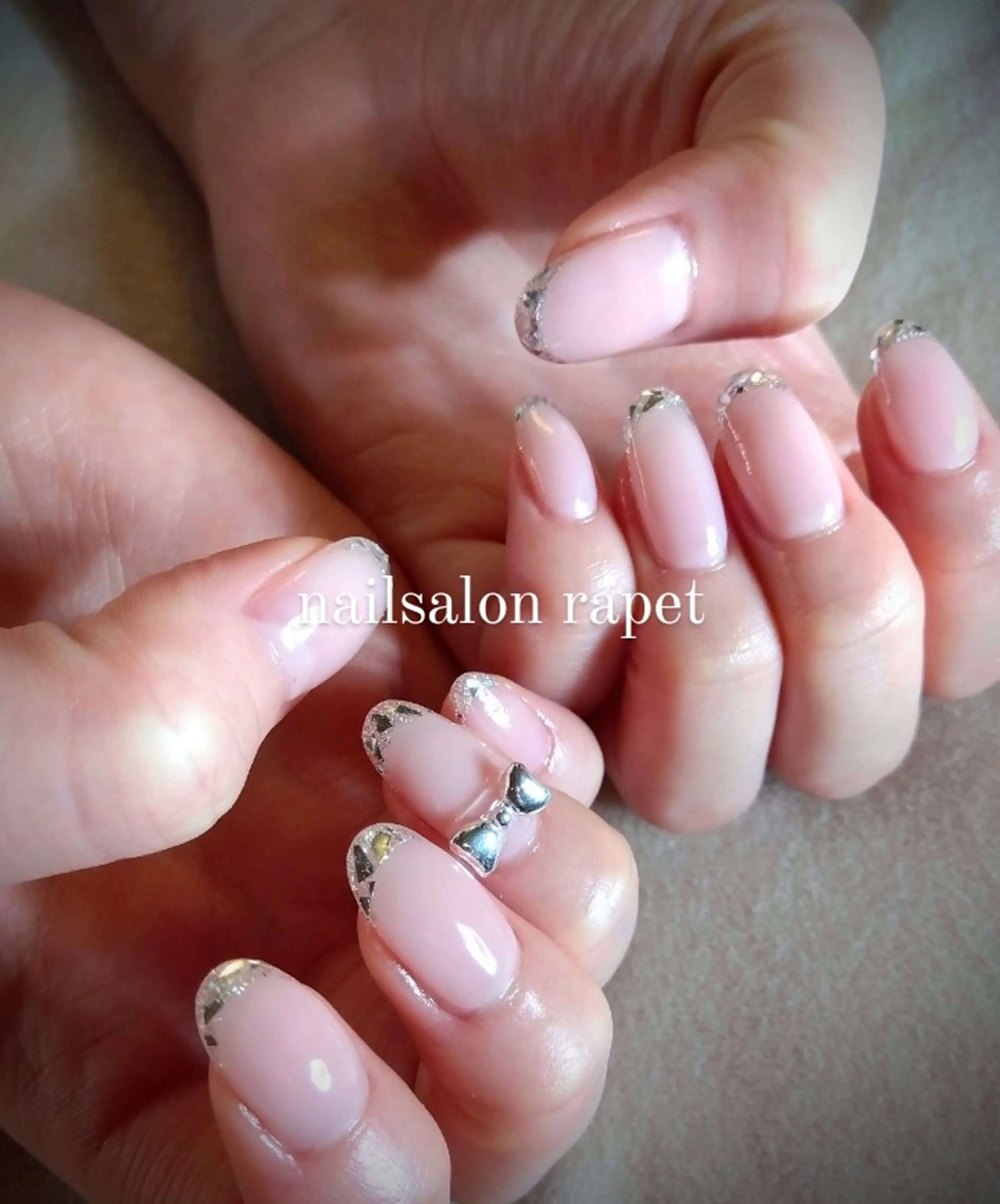ネイル リボン ハンドネイル nailsalon rapet所属・nailsalon  rapetのネイルデザイン