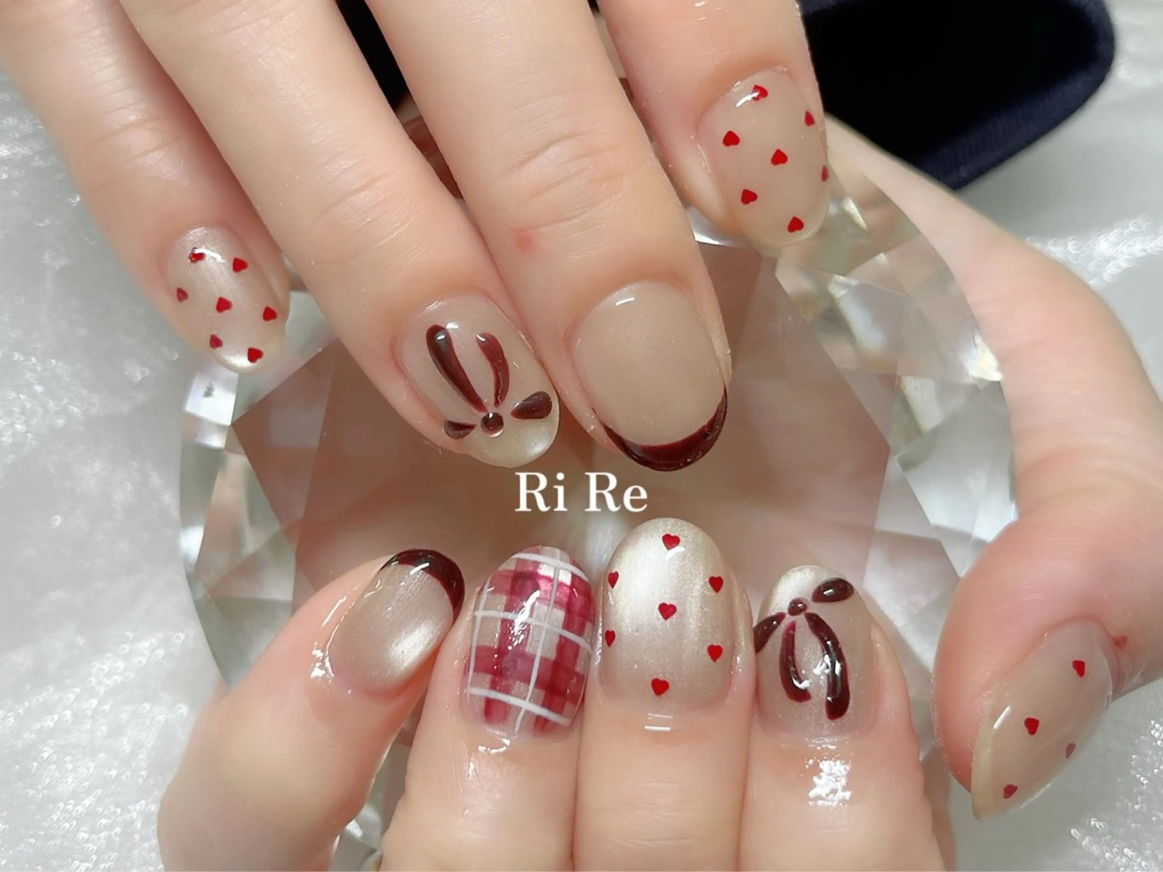 ネイル アートネイル ハート マグネットネイル 赤色 リボン Nailsalon RiRe♡Reikaのネイルデザイン