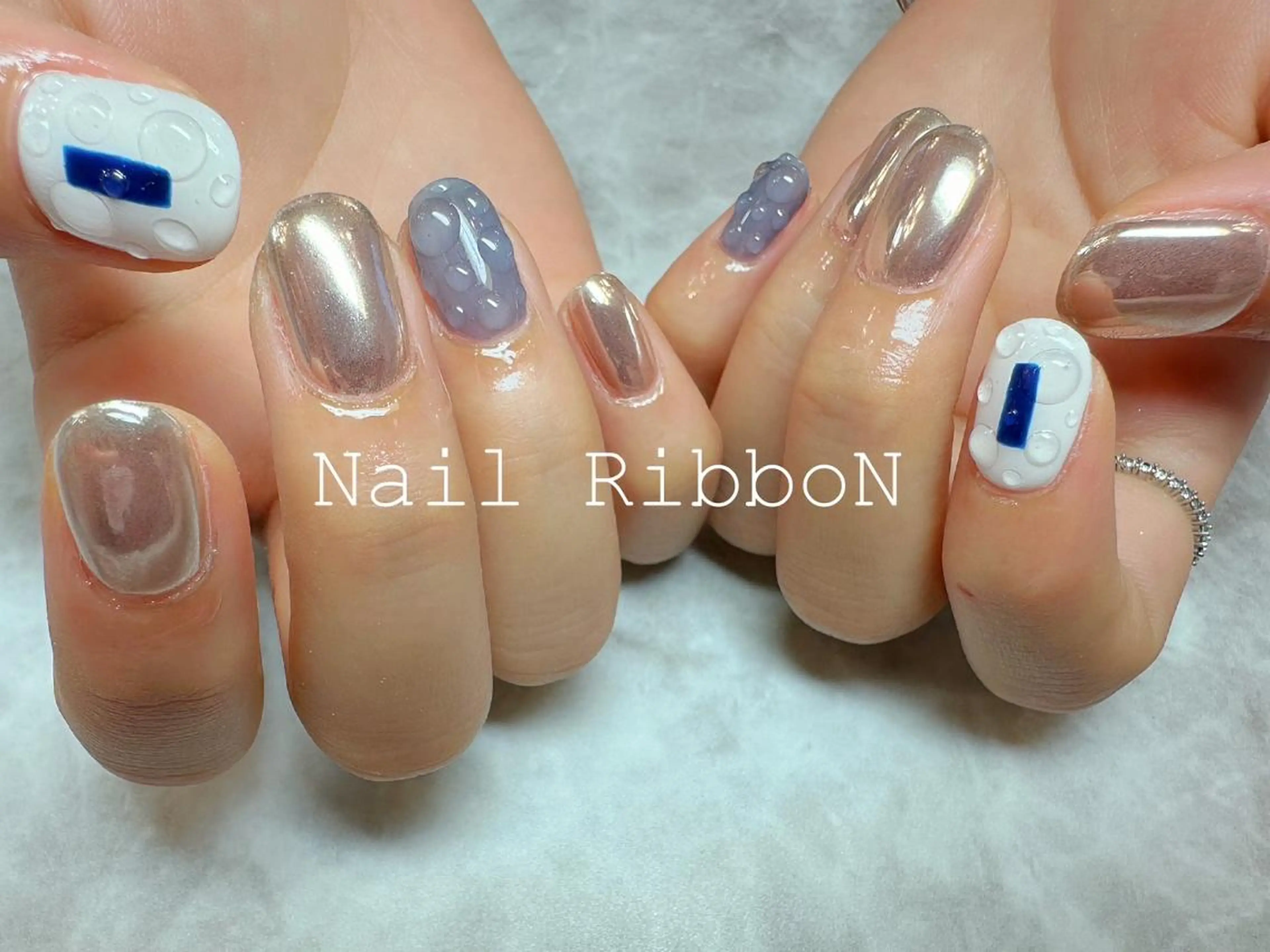 ネイル ネイルリボン 受付スタッフのマツエク・マツパデザイン