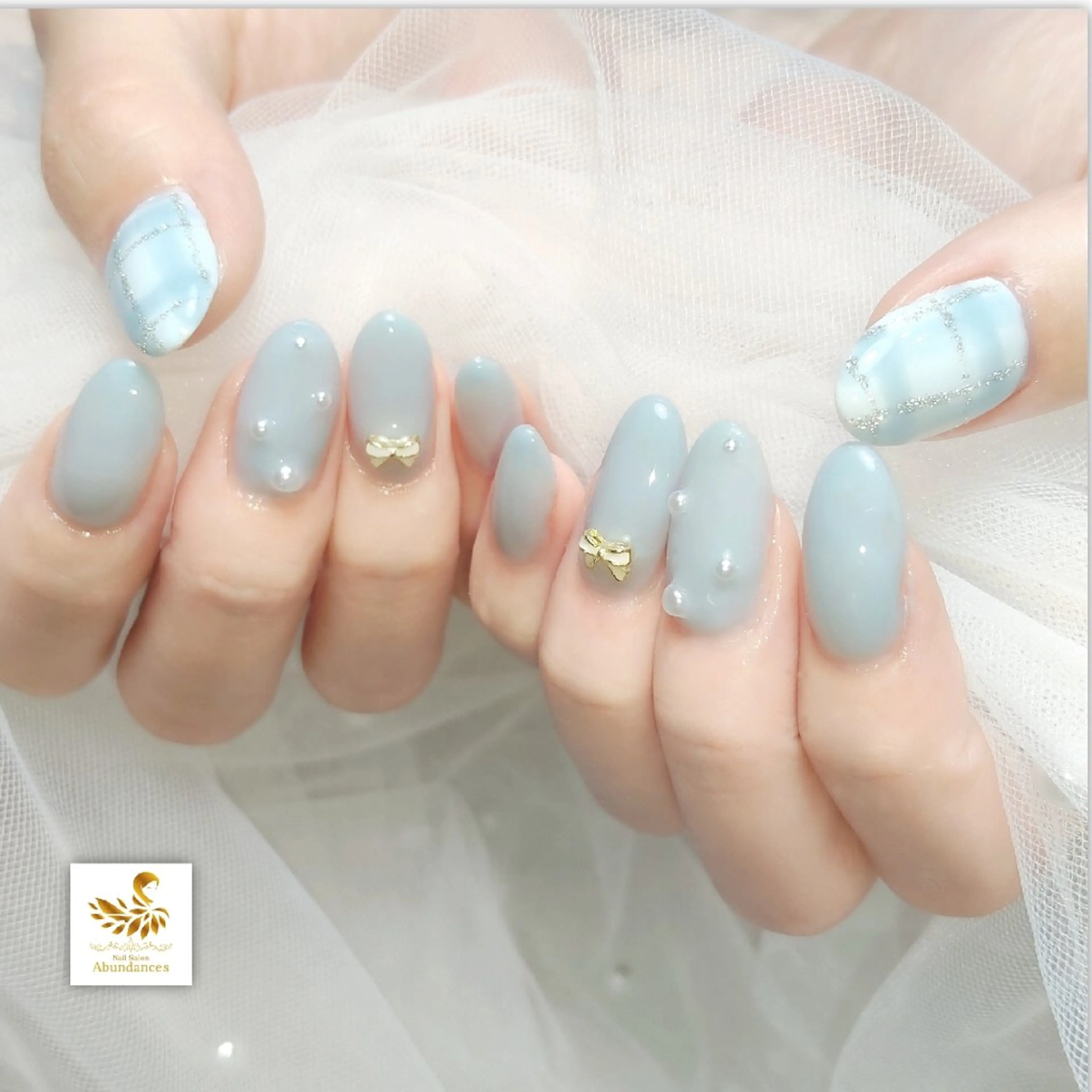 ネイル 水色 リボン 冬ネイル ハンドネイル 完全予約制個室サロン Abundancesのネイルデザイン