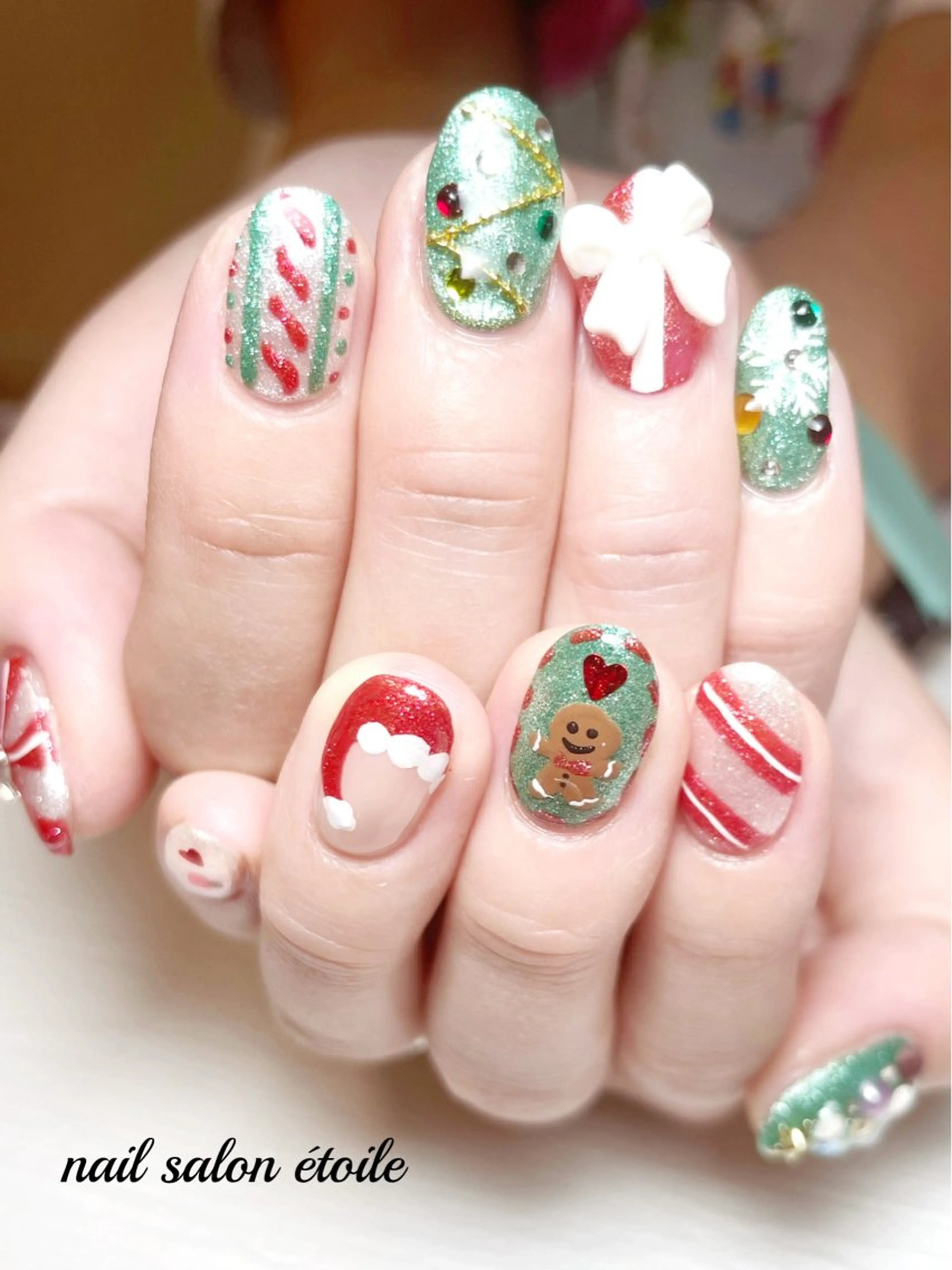 ネイル リボン 冬ネイル クリスマス ハンドネイル nail salon étoileのネイルデザイン