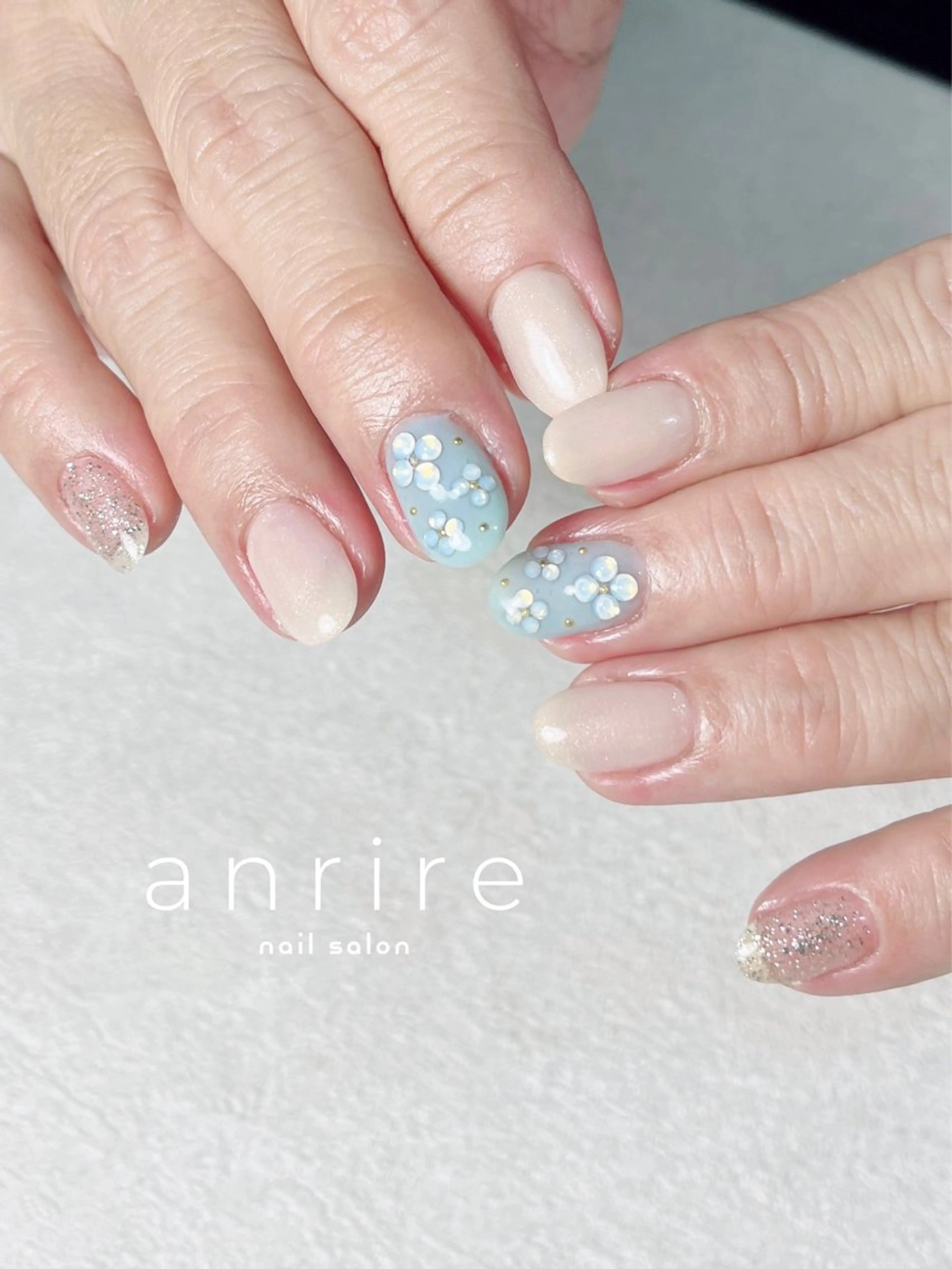 ネイル ブルー フラワーネイル フットネイル ジェルネイル キラキラネイル ハンドネイル nail salon anrire〜アンリール〜所属・nailsalon anrireのネイルデザイン