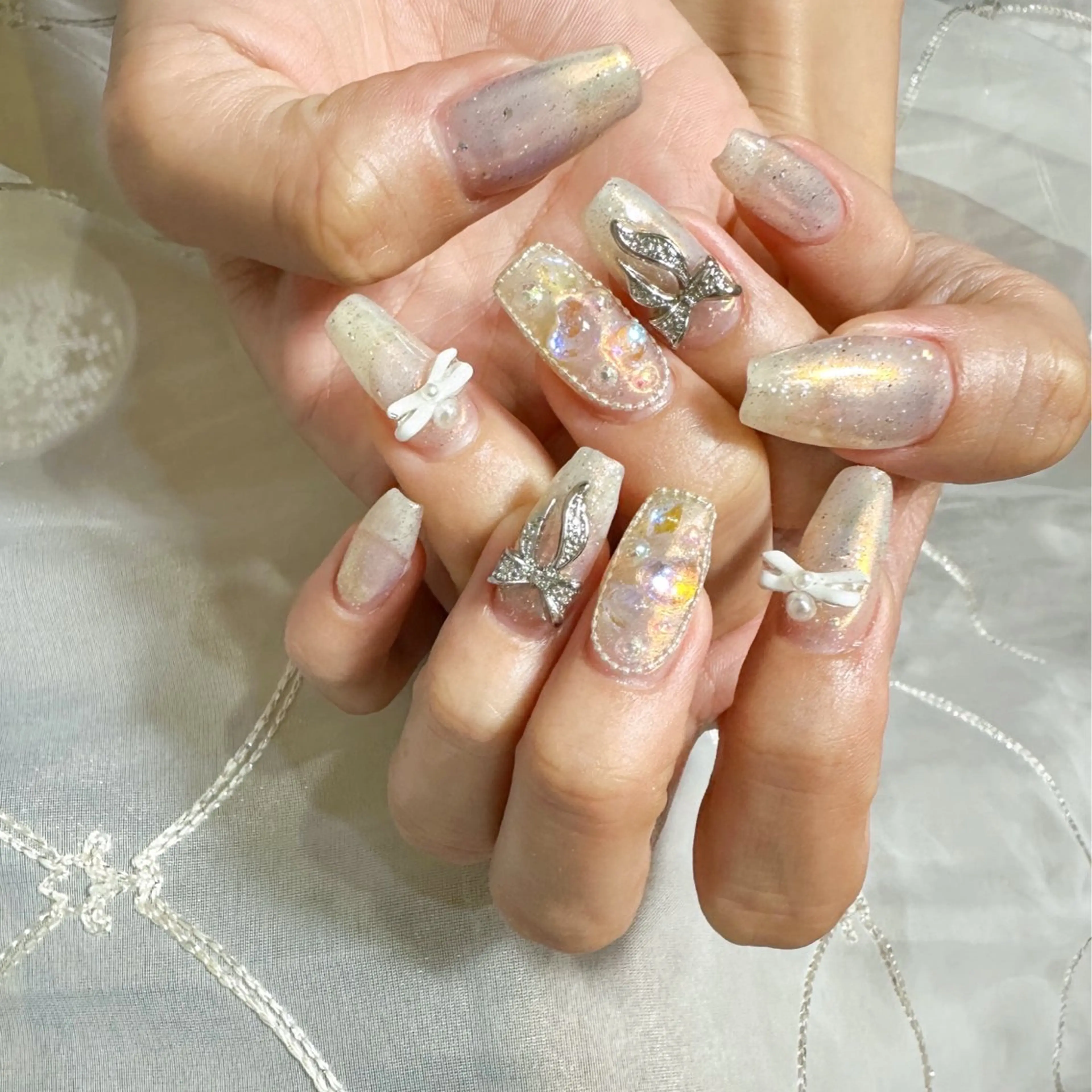 ネイル オーロラネイル キラキラネイル リボン ハンドネイル private nailsalonのネイルデザイン