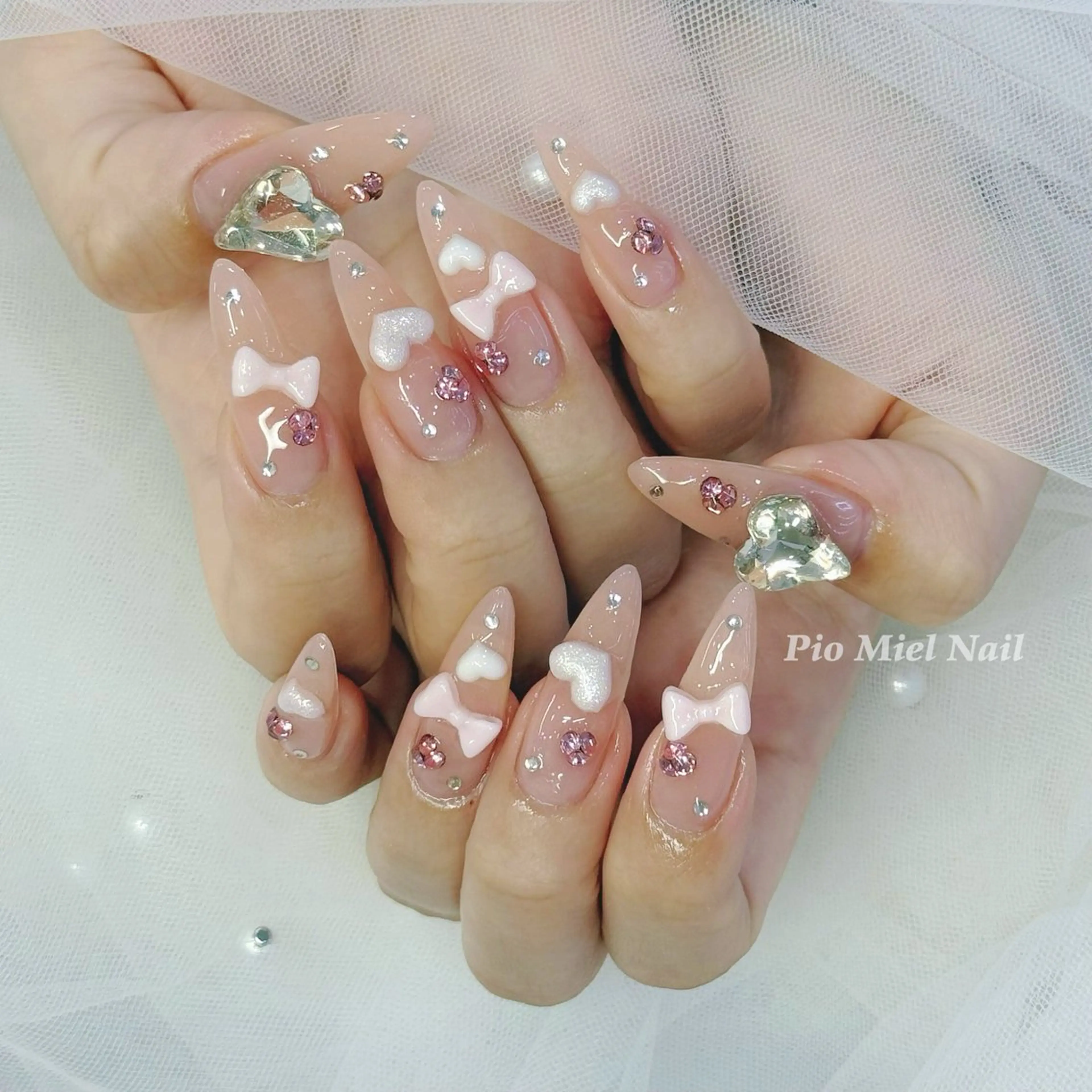 ネイル ガーリー ハート ピンク リボン ストーンネイル ハンドネイル HANA 長さだしのネイルデザイン