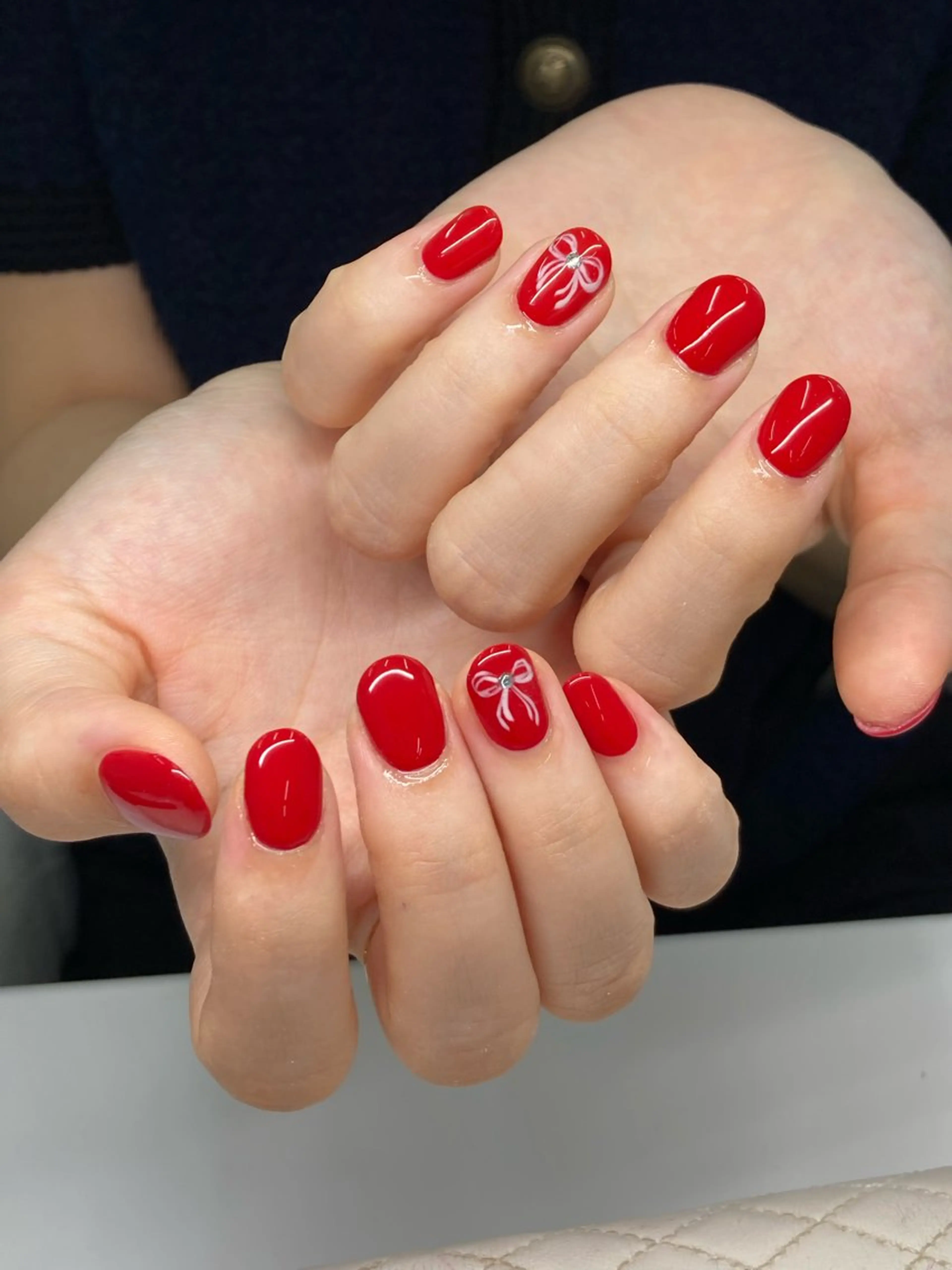ネイル 赤色 リボン Nail Total beauty salon Laki所属・佐々木 優花のネイルデザイン