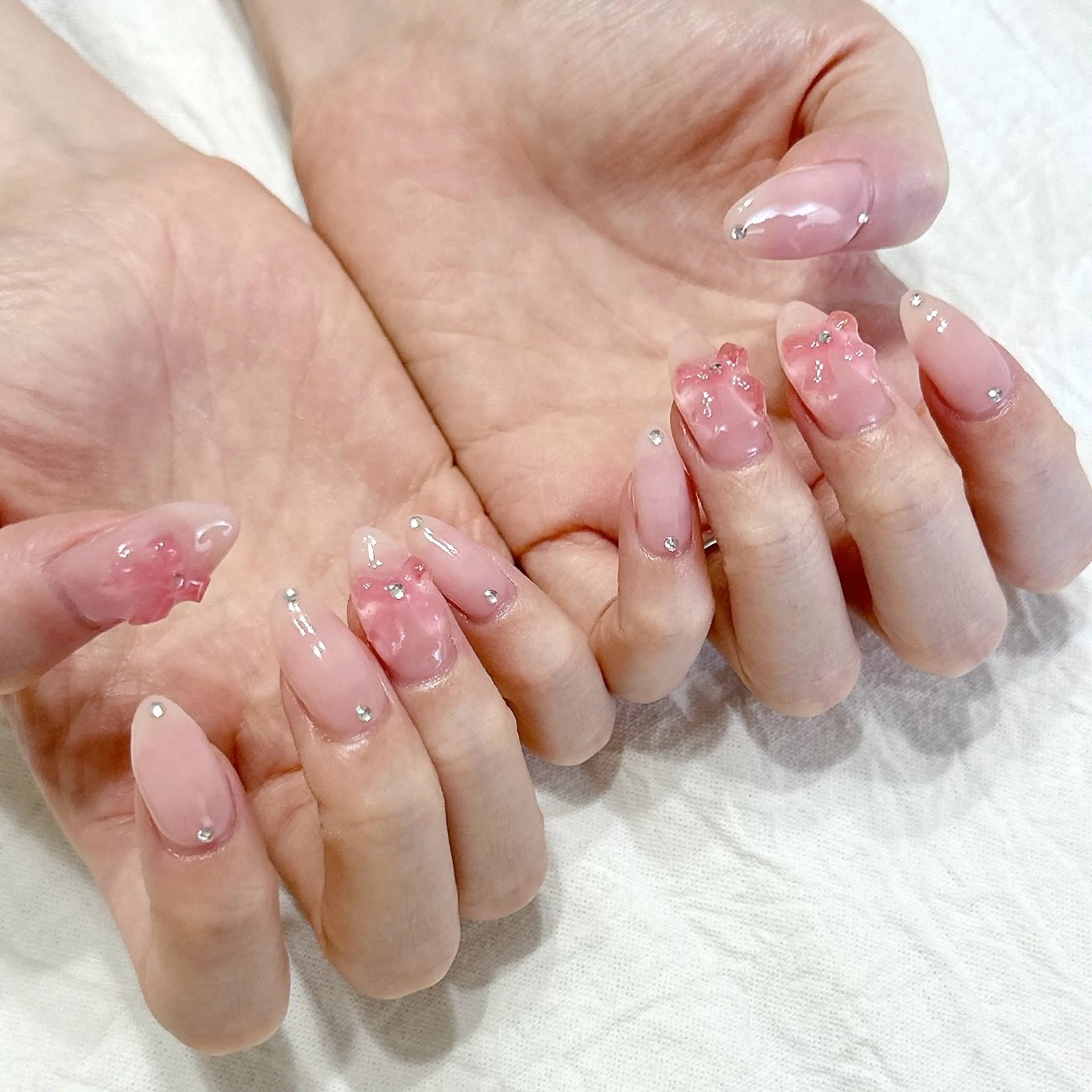 ネイル ピンク リボン シルバー ストーンネイル ハンドネイル peaberry nailのネイルデザイン