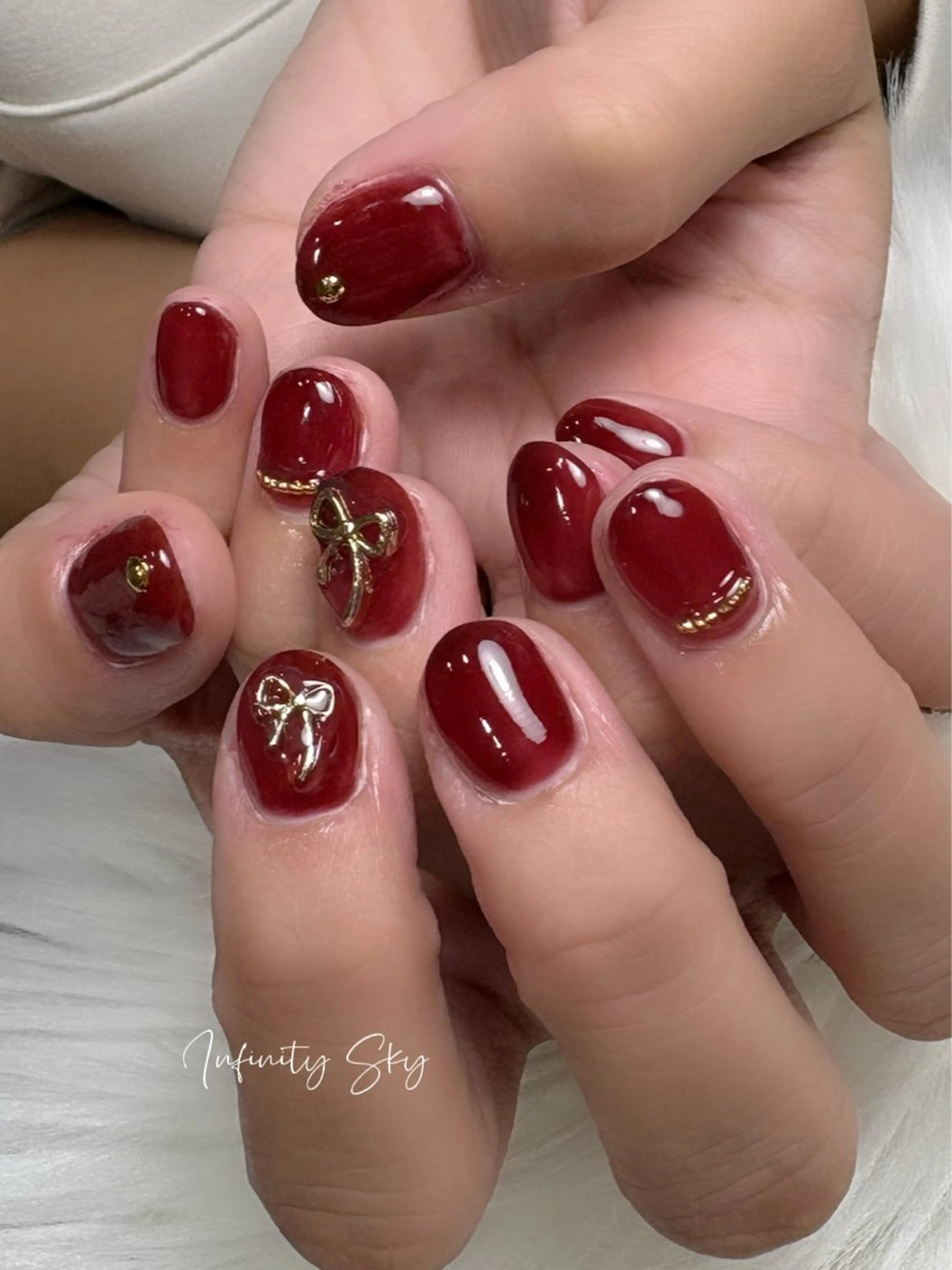ネイル 赤色 リボン infinity skyのネイルデザイン