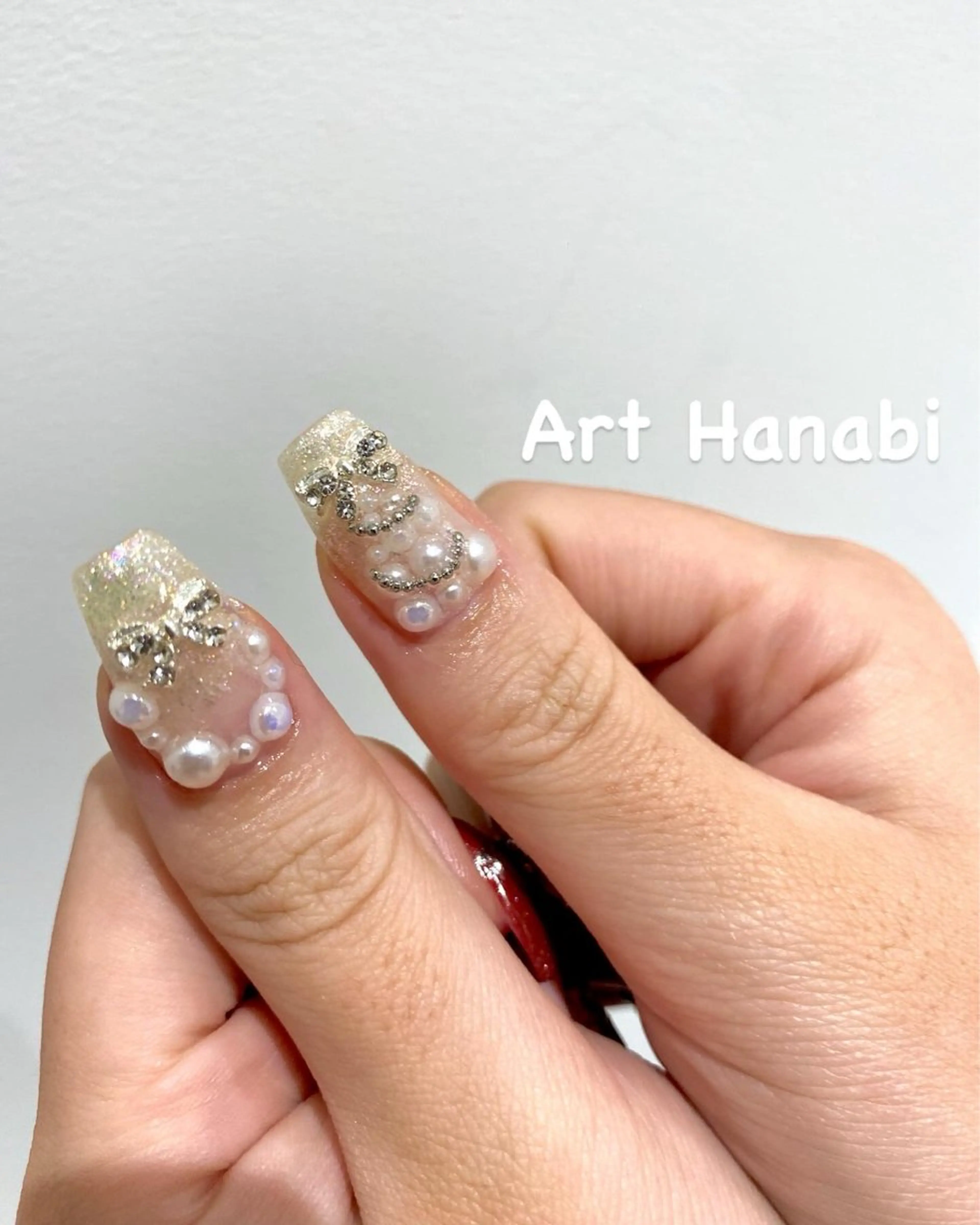ネイル リボン 冬ネイル クリスマス Art Hanabi所属・Art Hanabi ミリのネイルデザイン