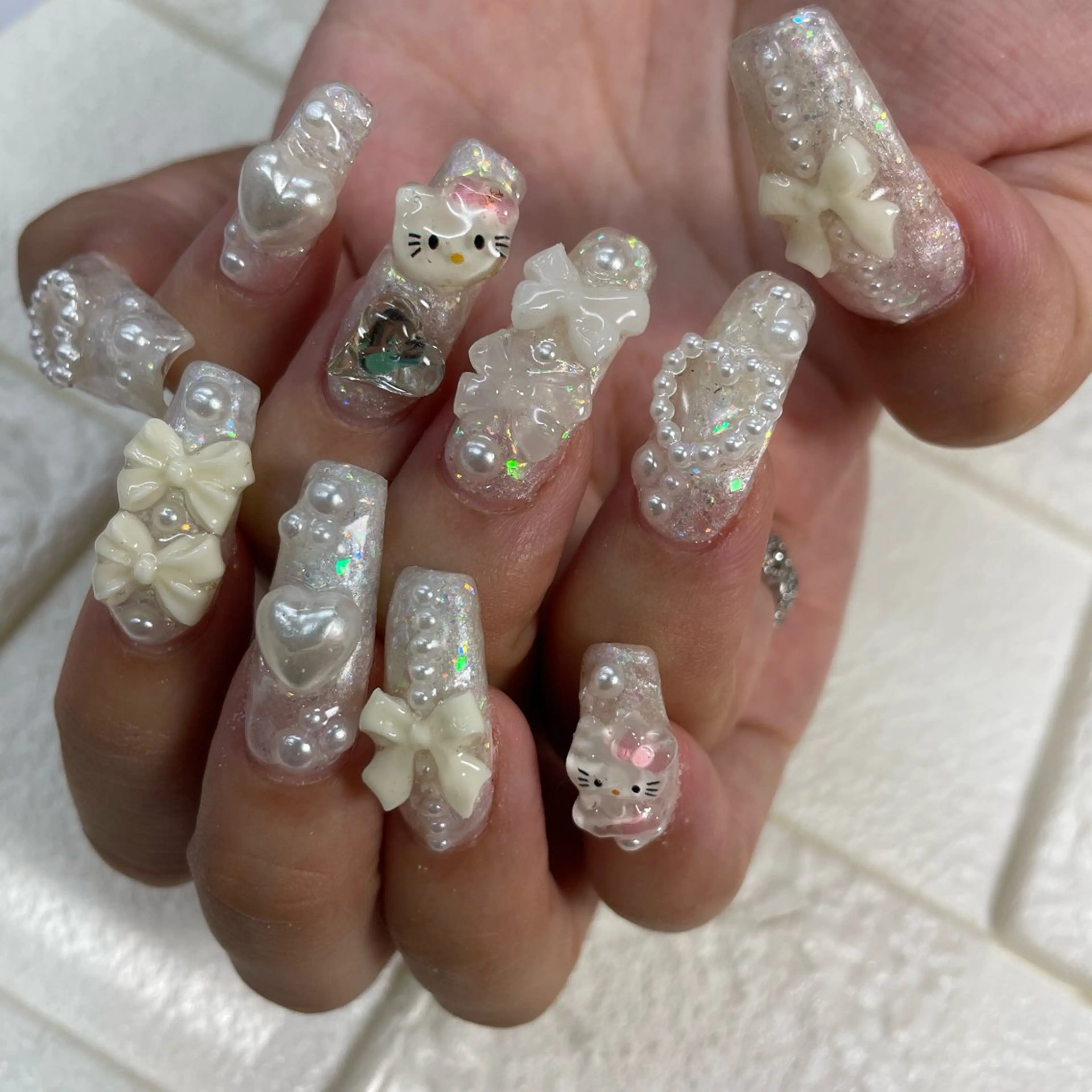 ネイル アートネイル ハート リボン ストーンネイル ハンドネイル pilina所属・pilina ピリナのネイルデザイン