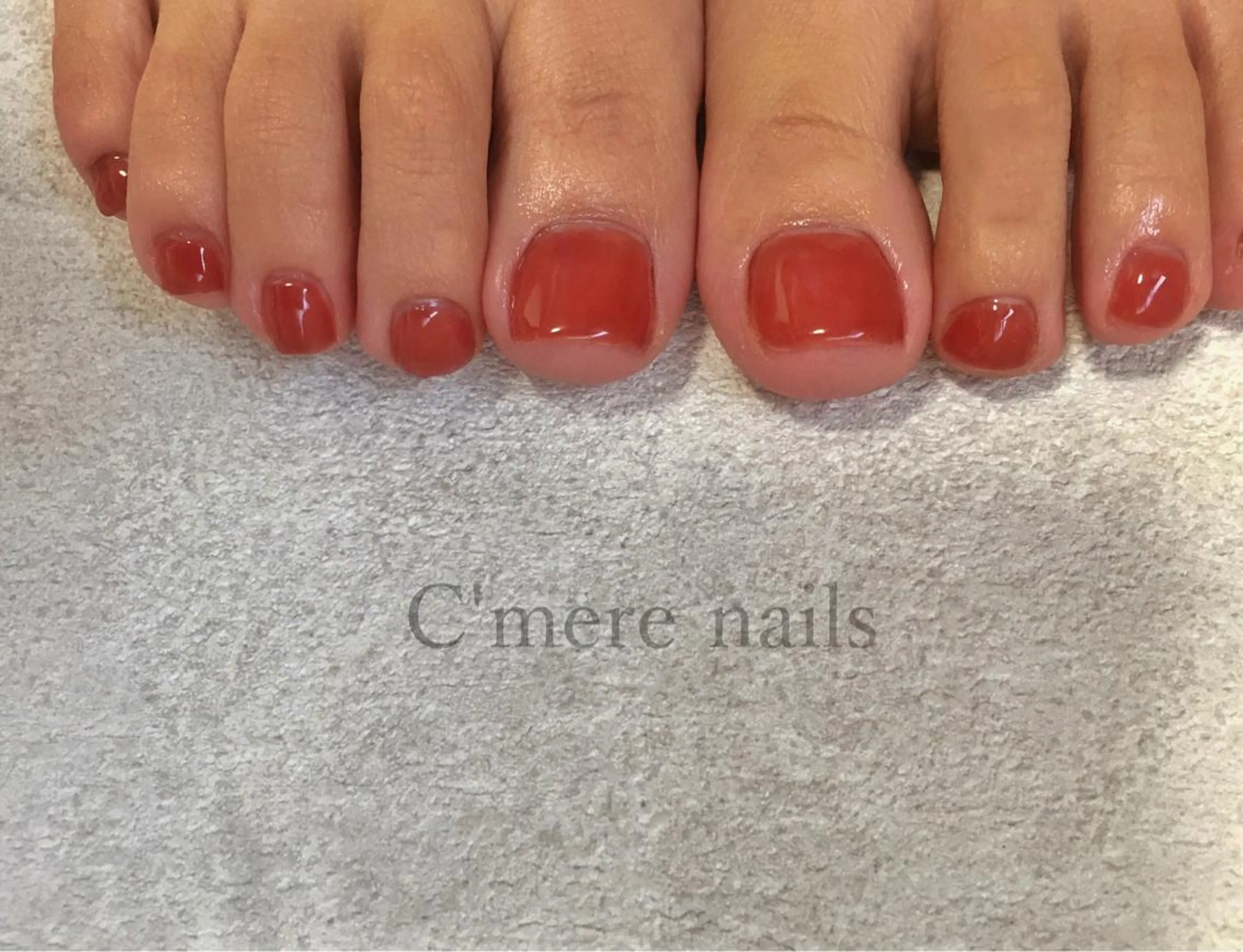 ネイル アートネイル ジェルネイル ワンカラーネイル オレンジ 赤色 フットネイル C'mere nailsのネイルデザイン