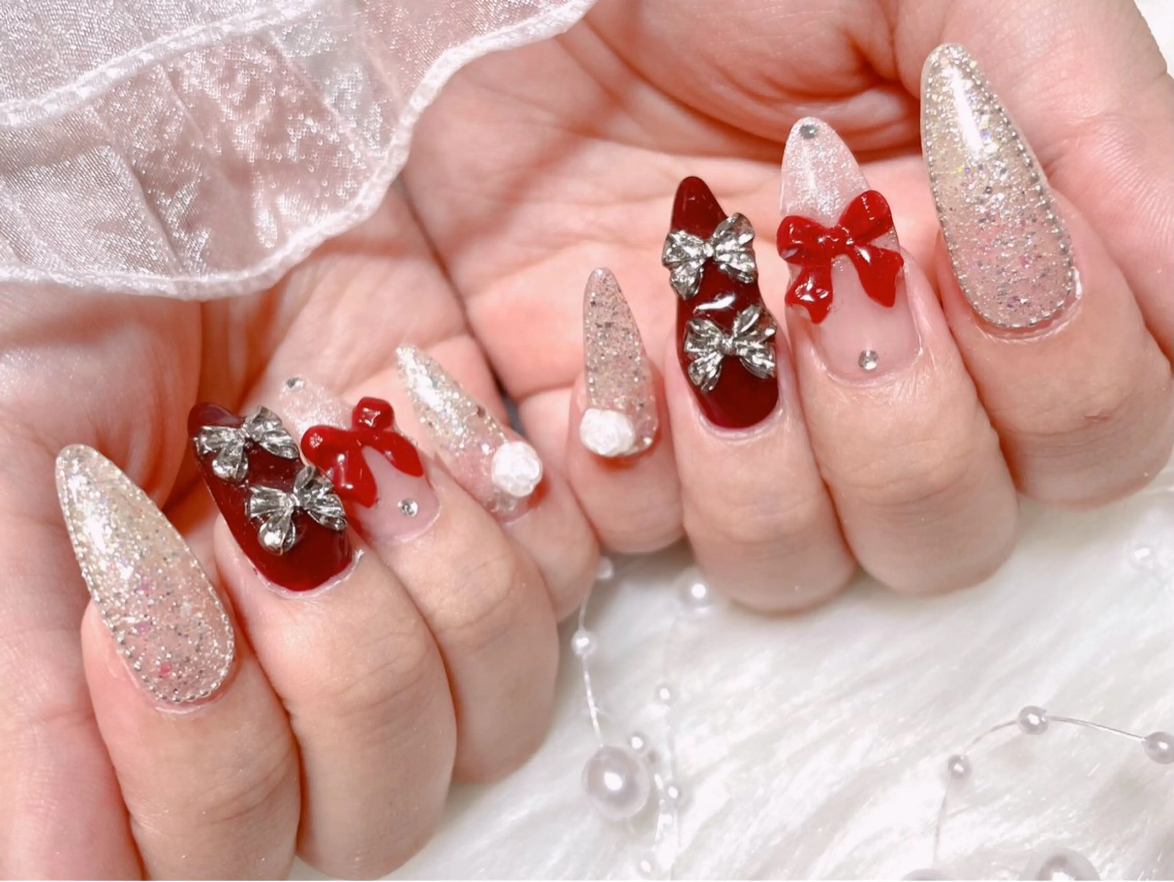 ネイル ロングネイル リボン ワンホンネイル 冬ネイル ゆりか ジョアアンジェ福島のネイルデザイン