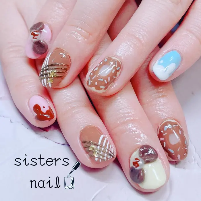 カラフルパステルなとろりんチョコと紗々ネイル ドーナツ Sistersnail F所属 Sisters Nail Fの ネイルデザイン ミニモ