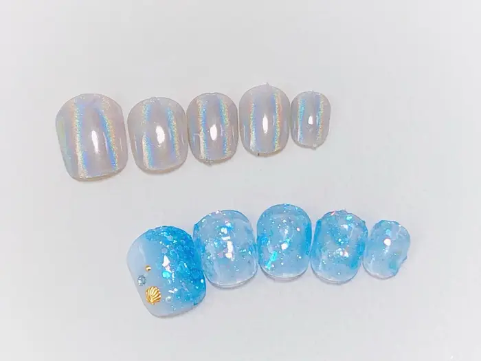 フットネイルデザイン 海ネイル 貝殻ネイル ユニコーンパウダー Nailsalon Eve所属 Nailsalon Eve イヴ のネイル デザイン ミニモ