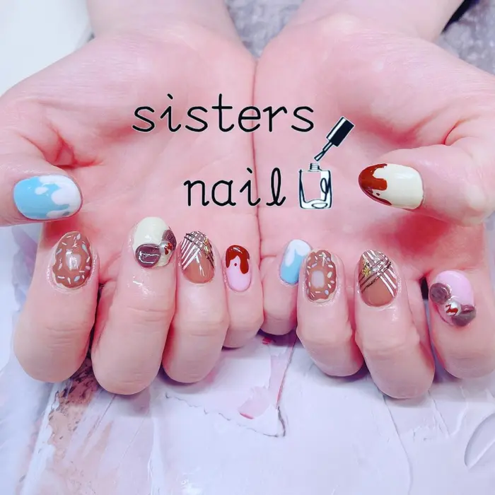 カラフルパステルなとろりんチョコと紗々ネイル ドーナツ シスターズネイルドットエフ所属 Sisters Nail Fのネイル デザイン ミニモ