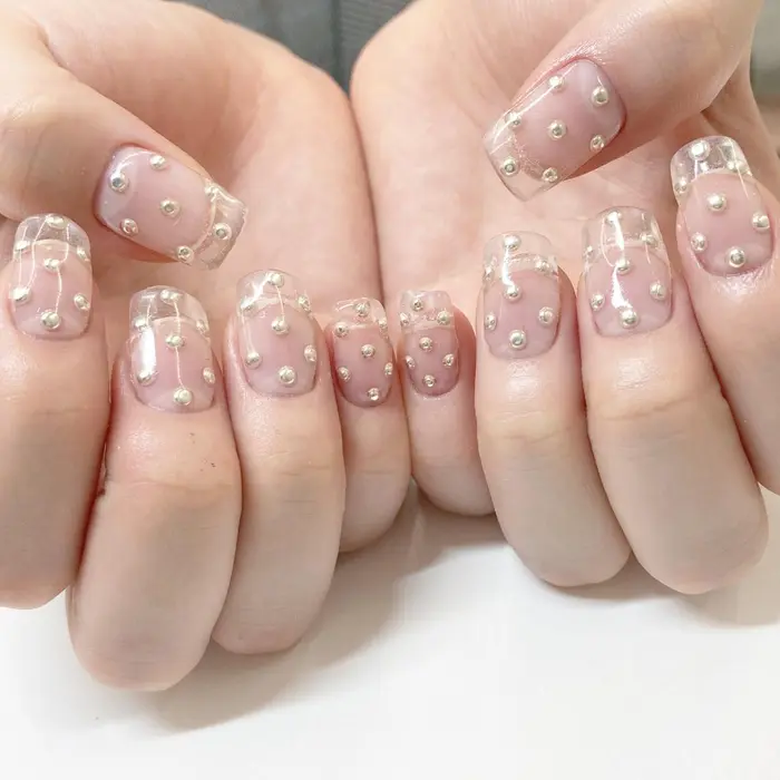 クリアの10本長さだしにスタッズドットネイル Minami Nail所属 Haruka のネイルデザイン ミニモ