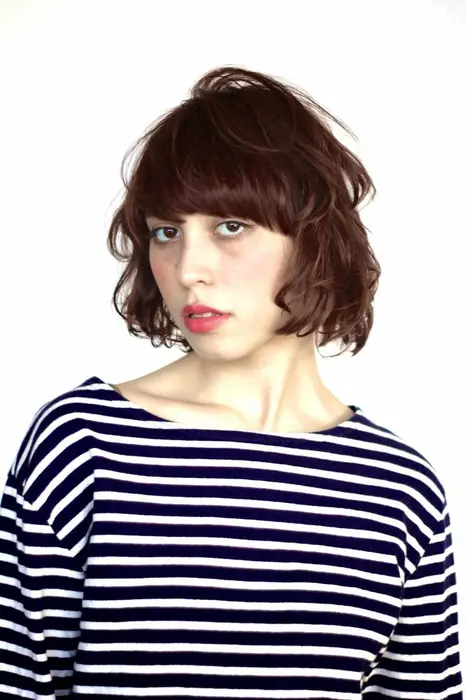 モデルのグレースちゃん ラフなパーマにピンクアッシュで春にぴったりのスタイルに仕上げました Hair Lounge Paa所属 新村 恭兵のヘア カタログ ミニモ